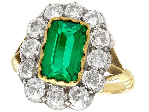 Emerald cluster engagement ring