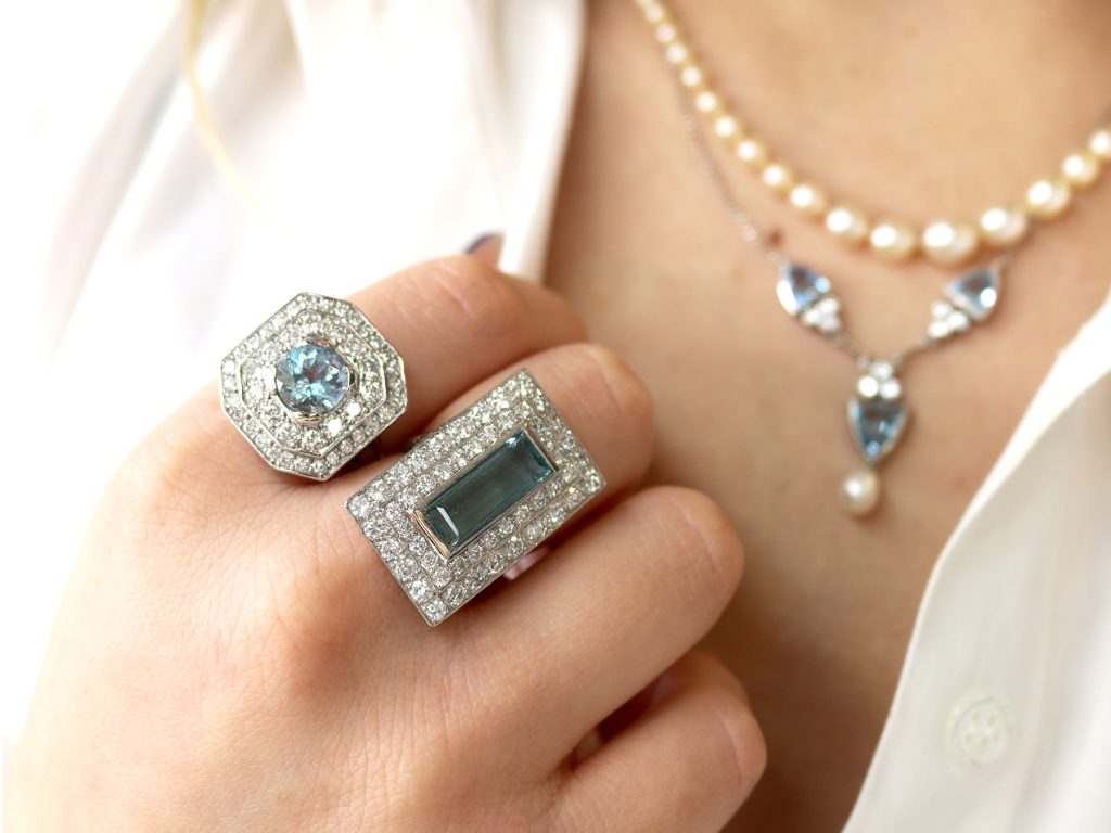 wearing aquamarine rings and necklace 