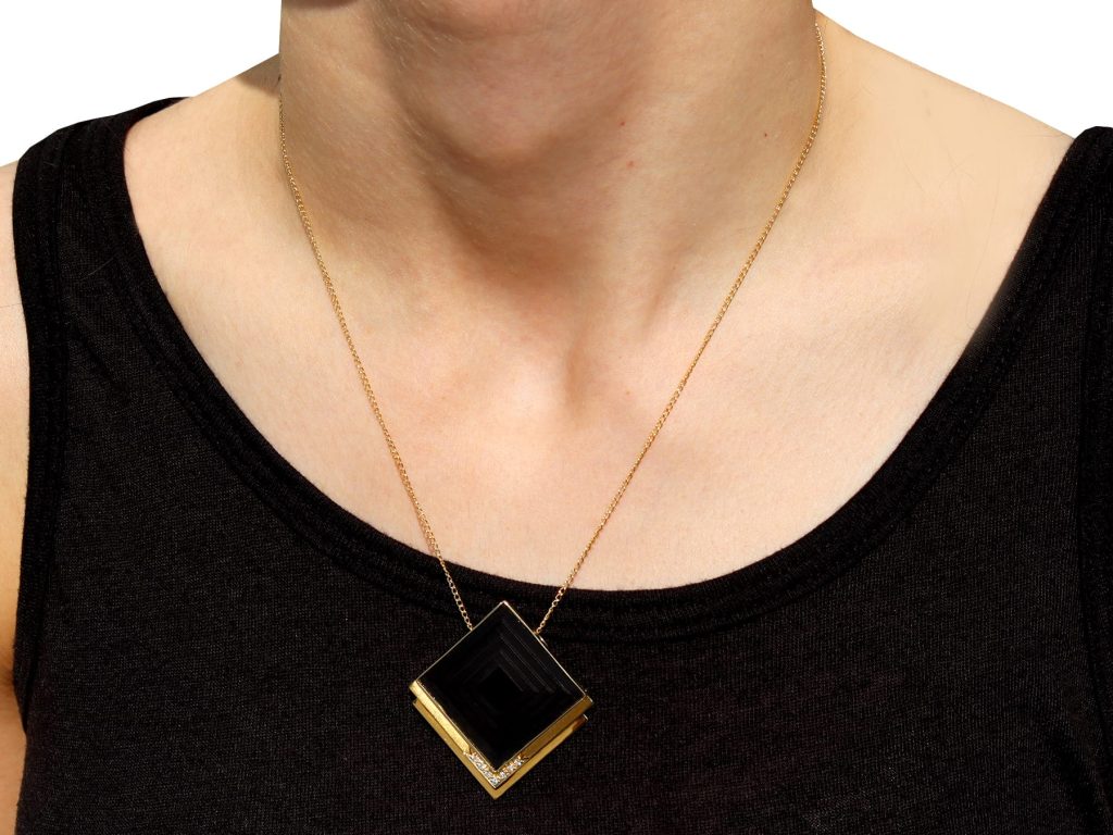 wearing 1970s geometric pendant and brooch 