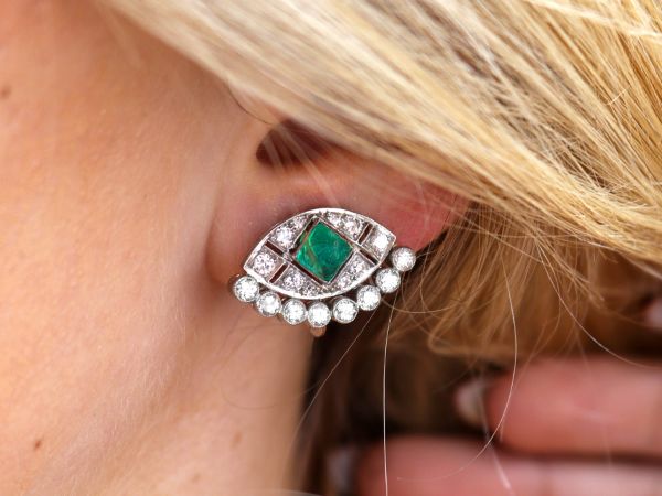 emerald diamond earrings on ear 