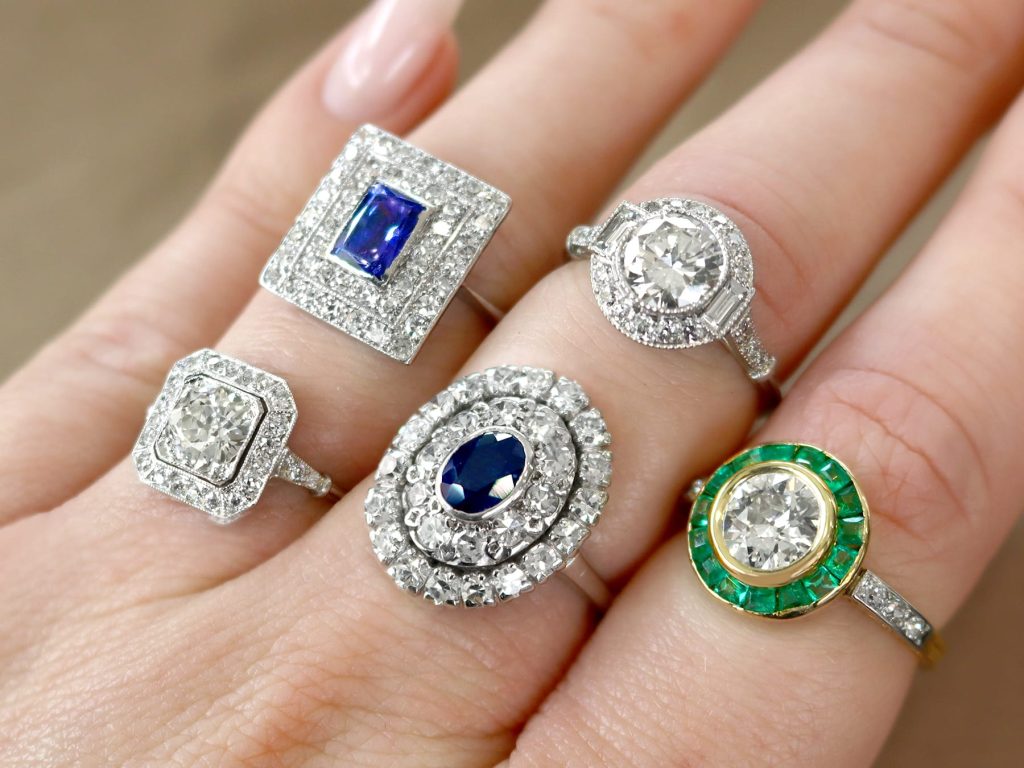 gemstone halo rings on hand 