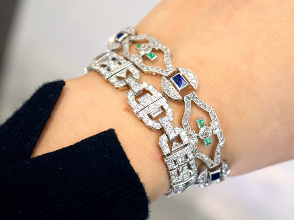 gemstone bracelets stacked on wrist 