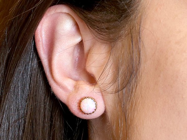 opal earings wearing with brown hair 